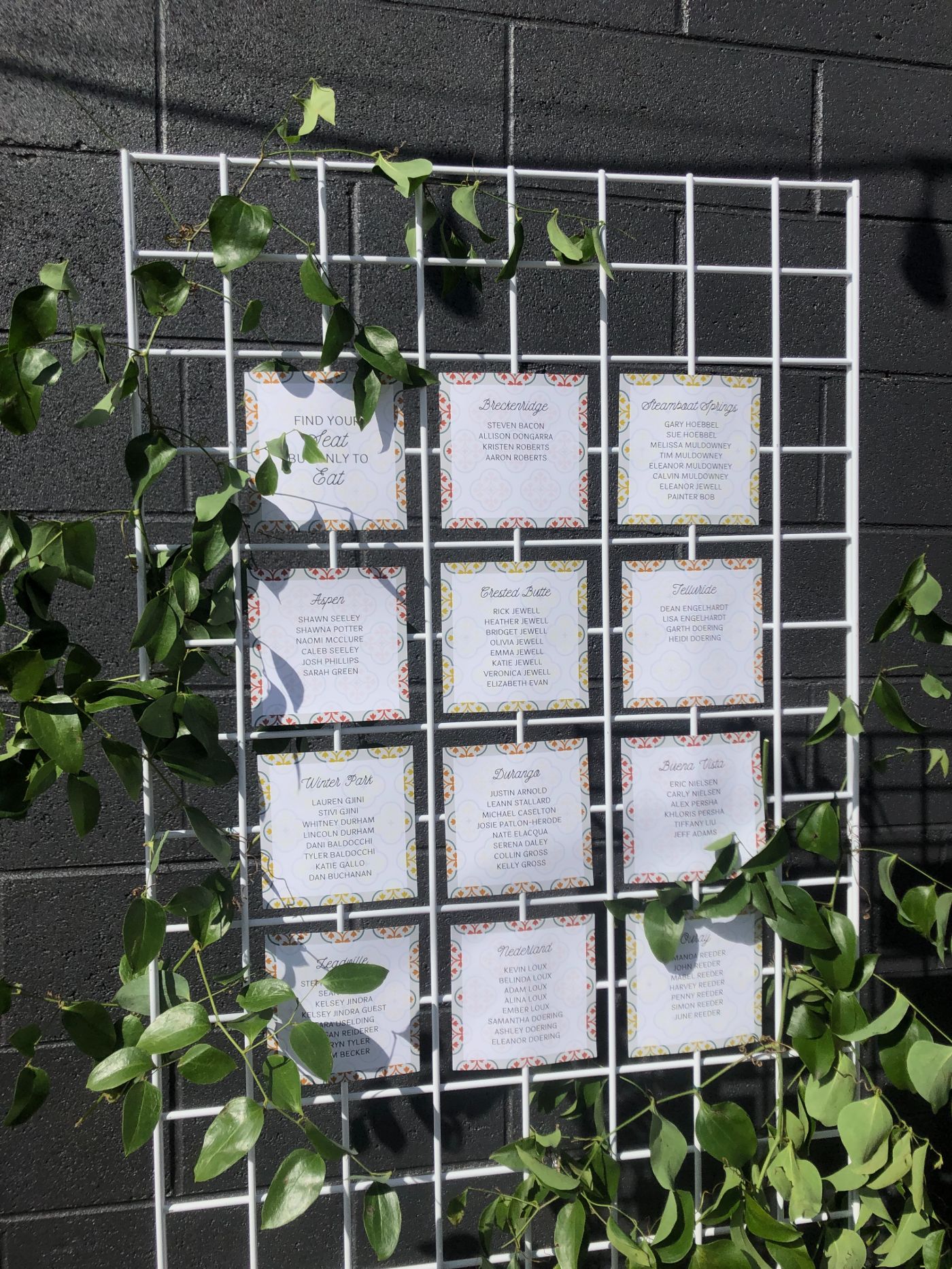 Wedding seating chart with floral cards and greenery at Radius Indianapolis, a modern event and wedding venue for celebrations.