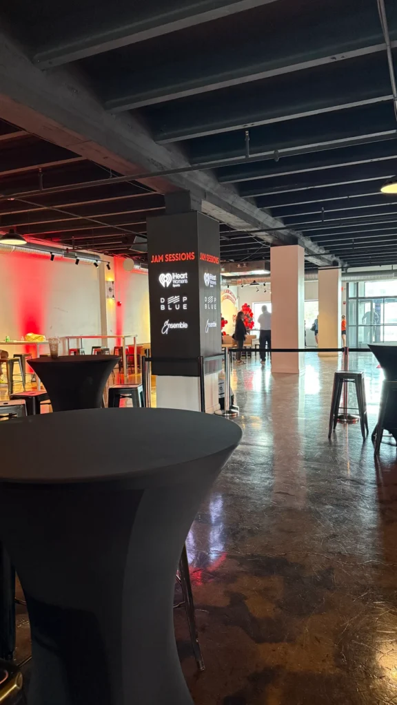 Radius in Indianapolis set up for a corporate event with high-top seating and  company logos on their customizable pillars