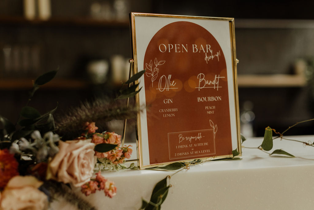 Custom drink menu sign displayed at the open bar at Radius wedding venue in Indianapolis