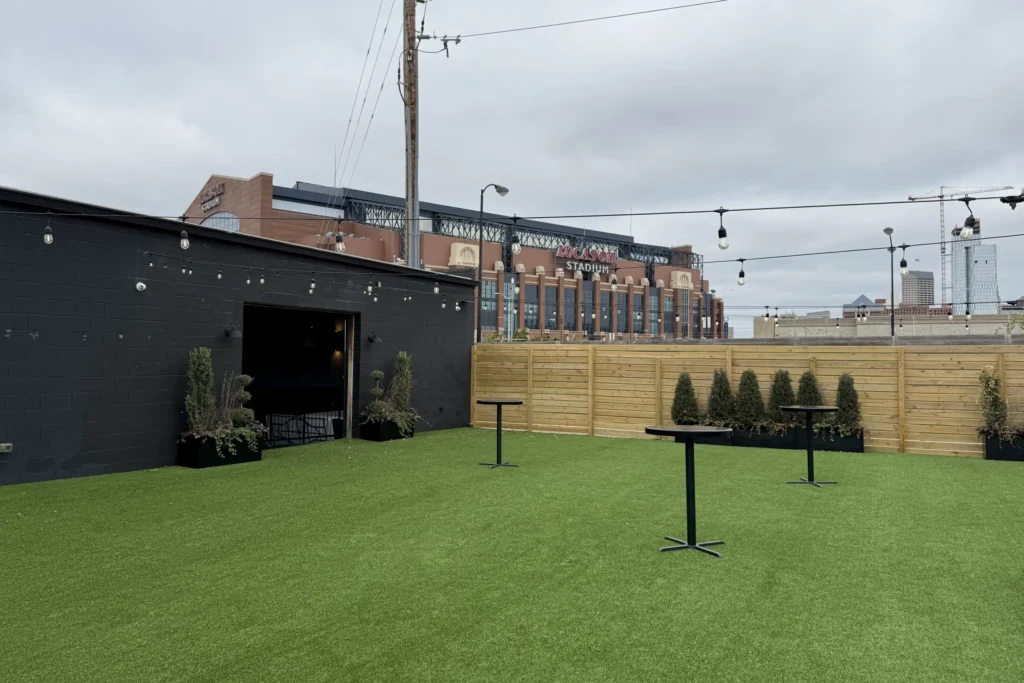 Outdoor wedding space at Radius with Lucas Oil Stadium visible in the background