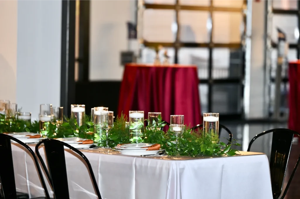 Indianapolis charity event setup with reception table and cocktail tables in the background.