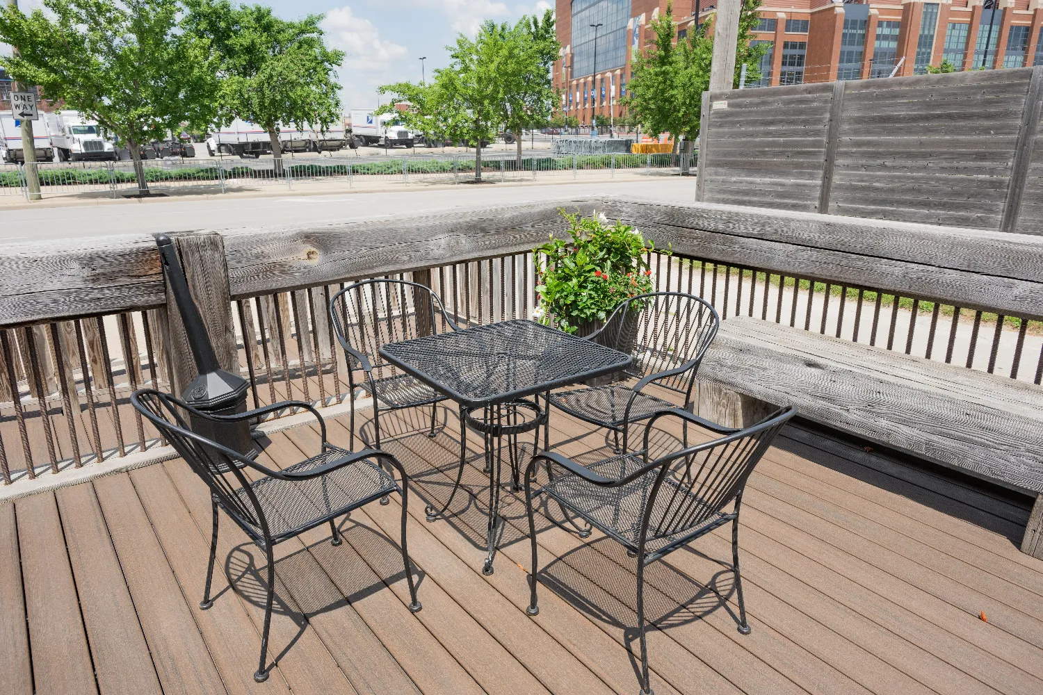 Umbrellas and stands on the outdoor wrought iron patio at Radius Venue Indianapolis