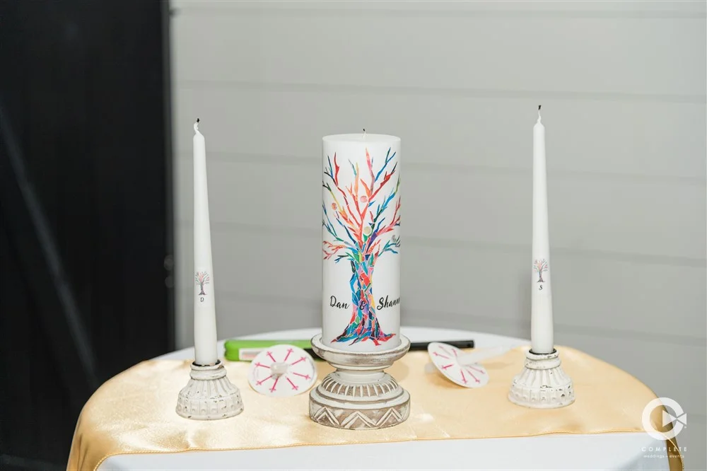 Custom wedding candles at ceremony altar