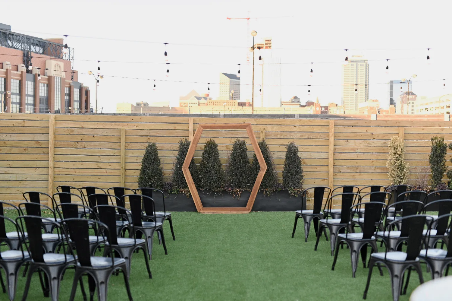 Wood hexagon arch decorated for a wedding at Radius Venue in downtown Indianapolis