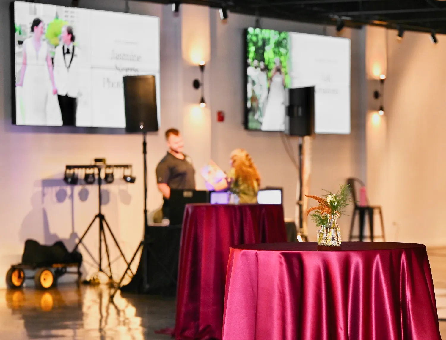 Three TV displays on the north wall showing a slideshow at Radius Venue Indianapolis